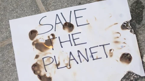 Save The Planet Poster Burning, Close Up Stock Footage 126317608