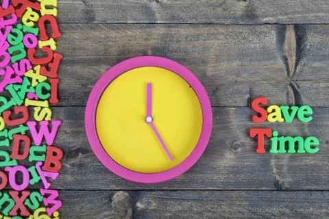 Save Time on wooden table 写真素材
