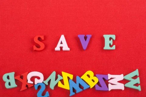 SAVE word on red background composed from colorful abc alphabet block woode.. Stock Photos
