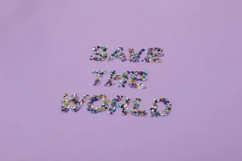 Save the world text consisting of small plastic pellets collected and recycle 스톡 사진