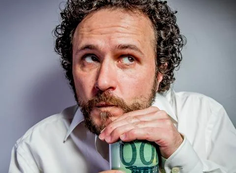Saver, man with intense expression, white shirt Stock Photos