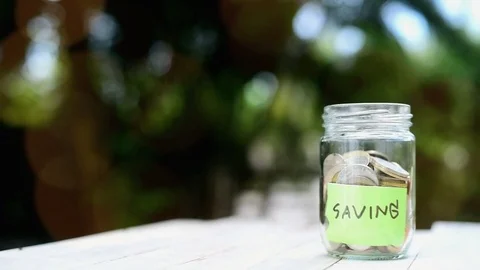 Saving coin in can  Stock Footage 80295695