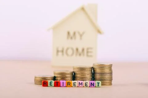 Saving concept, stacking coins and colorful alphabet letter dice text on whit Stock Photos