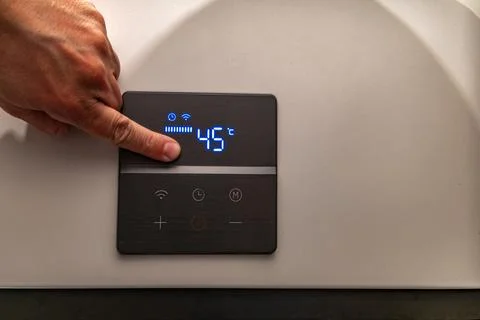 Saving electricity, setting the temperature in the water heater Stock Photos