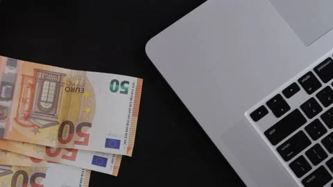 Saving euro earning salary to pay high government taxes Stock Footage 186169204