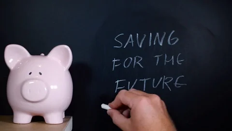 Saving for the future handwritten on a chalkboard Stock Footage 81931591