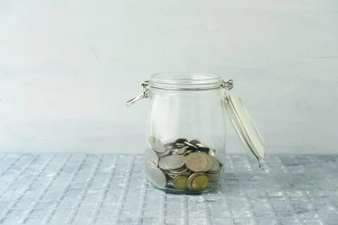 Saving jar with coins Stock Photos