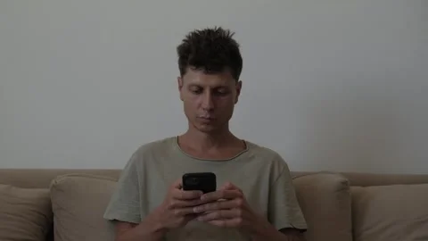 Saving money and improving personal finances, man checking smartphone and Stock-Footage 346245745