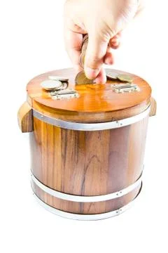 Saving money in a box Stock Photos