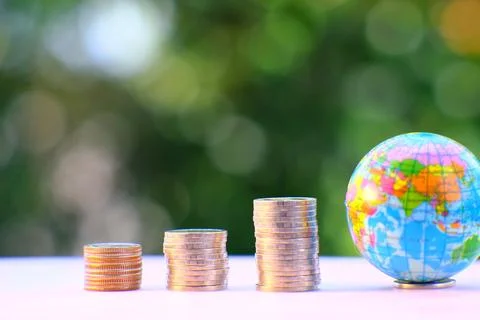 Saving money concept and stacking coins on table background business growth.. Stock Photos