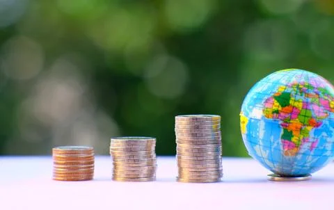 Saving money concept and stacking coins on table background business growth.. Stock Photos