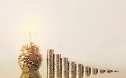 Saving money concept stack coins with money in the bottle glass growing for b Stock Photos