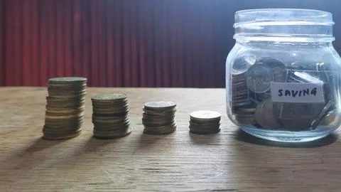 Saving Money in a Jar: A Simple Step Toward Big Dreams Stock Photos