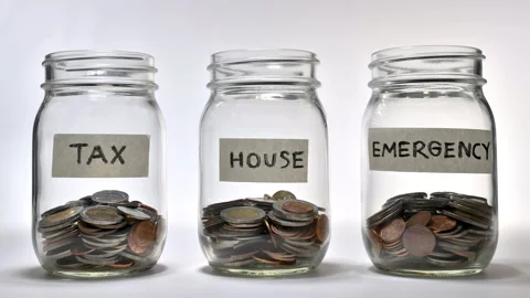 Saving money for multiple purpose - stop motion Stock Footage 141974159