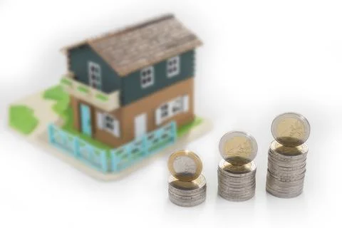 Saving money for a new house. Stack of coins Stock Photos