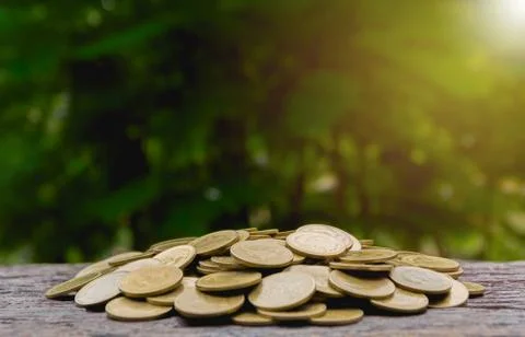 Saving money with stack of coin growing for business and accounting concept o Stock Photos