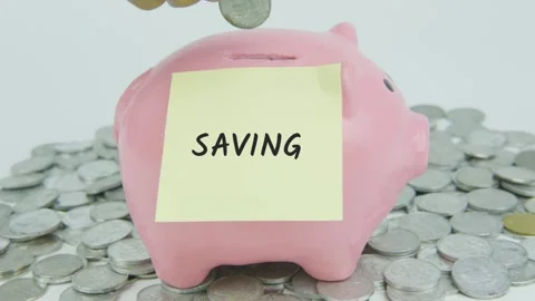 Saving Word Or Text on Yellow Note Paper and Hand Inserting Coins Stock Footage 301529308