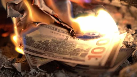 Savings burning in slow motion Stock Footage 255022725