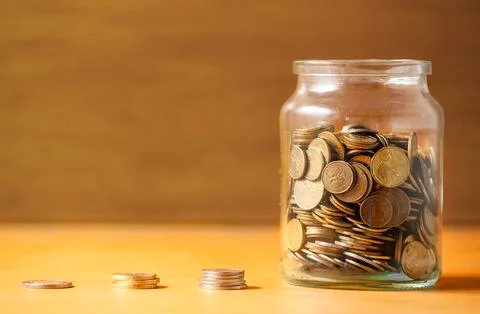 Savings in a jar. Stock Photos