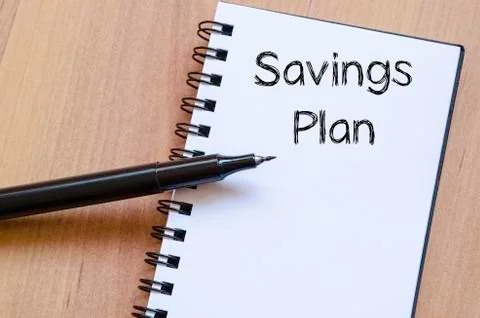 Savings plan write on notebook Stock Photos