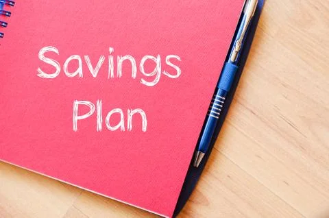 Savings plan write on notebook Stock Photos