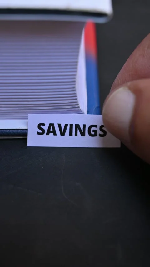 Savings Word on White Paper Representing Money Management and Financial Growth Video stock 338330242