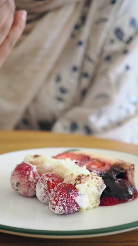 Savoring a delicious dessert using a fork in a humble and cozy environment 스톡 동영상 347696284