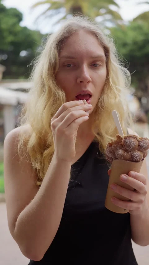 Savoring the Deliciousness of Ice Cream While Enjoying a Beautiful Sunny Day Stock Footage 305398069