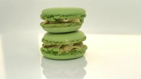 Savoring green tea macarons at a cozy bakery Stock-Footage 310651996