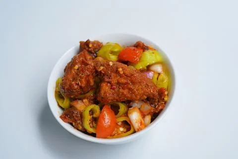 Savory Devil Chicken Dish in White Bowl for Dining. Stock Photos