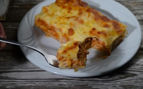 Savory dish served on a rustic table with rich layers of flavor at a cozy g.. Stock Photos