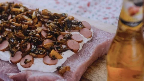 Savory dynamic preparation: slicing cooked sausage into rounds Stock Footage 342184529