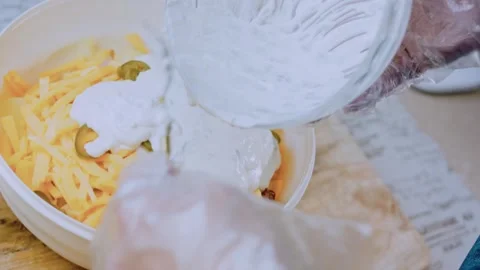 Savory fine dining angle: arranging the loaded potato salad Stock Footage 342198841