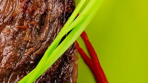 Savory on green plate: grilled meat 库存影片 43760153