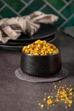 Savory Herb Cornbread Stuffing in a Modern Black Ceramic Bowl 写真素材