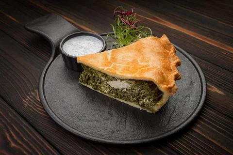 Savory kish pie slice with fresh herbs and cheese, close-up Stock Photos
