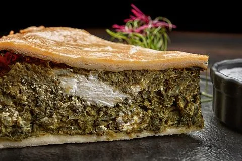 Savory kish pie slice with fresh herbs and cheese, close-up Stock Photos