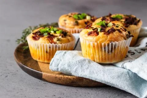 Savory muffins with bacon, quail egg, green onion cheese. Stock Photos