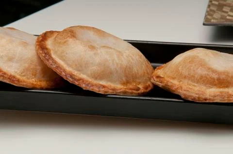 Savory pie filling served on a rectangular plate black 写真素材