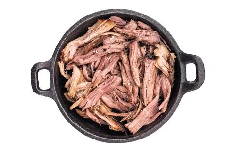 Savory pulled beef brisket served in a skillet, dipping  creating an appeal.. Stock Photos