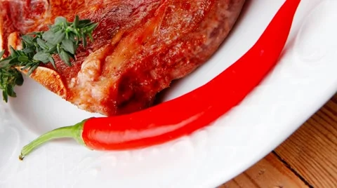 Savory : roasted beef spare rib on white dish with pepper and to Vídeos de archivo 57631395