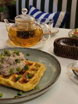 Savory waffles with pâté and fresh herbs Stock Photos