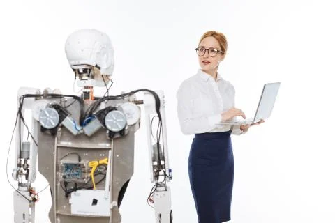 Savvy talented scientist coding the functions of the robot Stock Photos