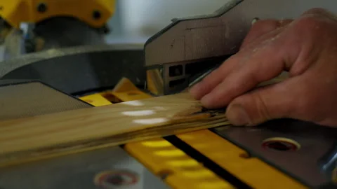Saw, electric power carpentry tools. Man is cutting wood beam on the Stock-Footage 309587285