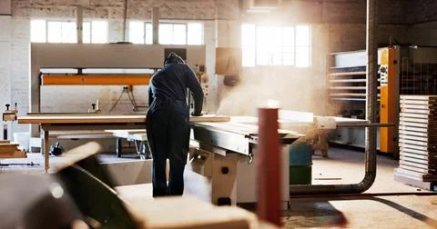 Saw, machine and back of carpenter in workshop for carpentry, wood project .. Stock Photos
