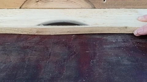 Sawing the board on the circular saw Stock Footage 149944006