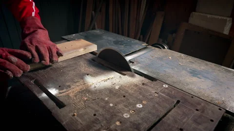 Sawing a board using a circular saw. Stock Footage 318586848