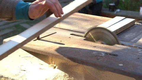 Sawing boards circular saw. The work of The joiner in the open air. Closeup Stock Footage 131014152