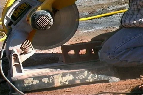 Sawing bricks with power saw Stock Footage