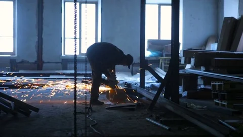 Sawing metal with a grinder Stock Footage 71100736